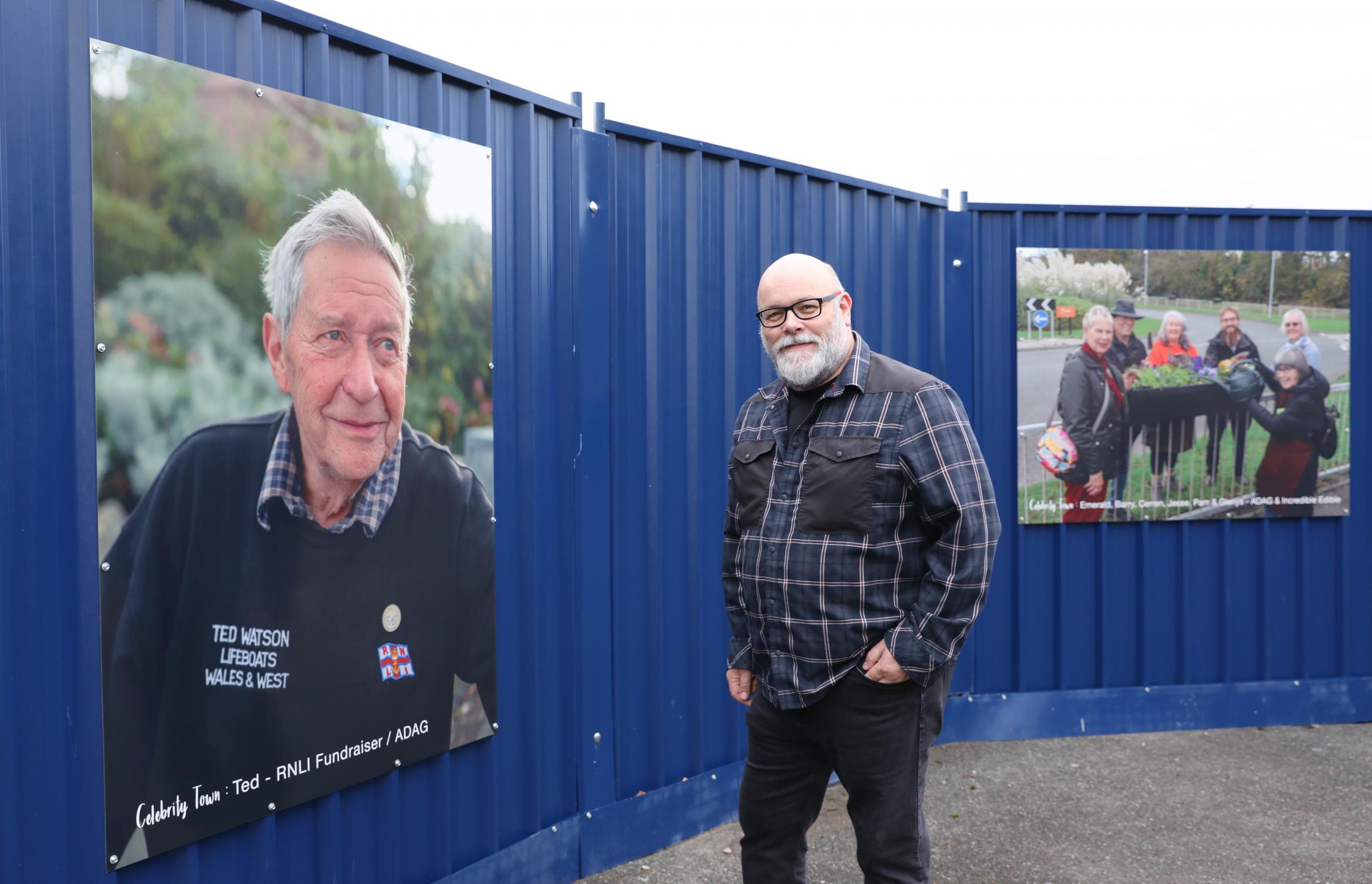 Curator of Oriel Colwyn Paul Sampson stands in front of image - Ted, RNLI fundraiser