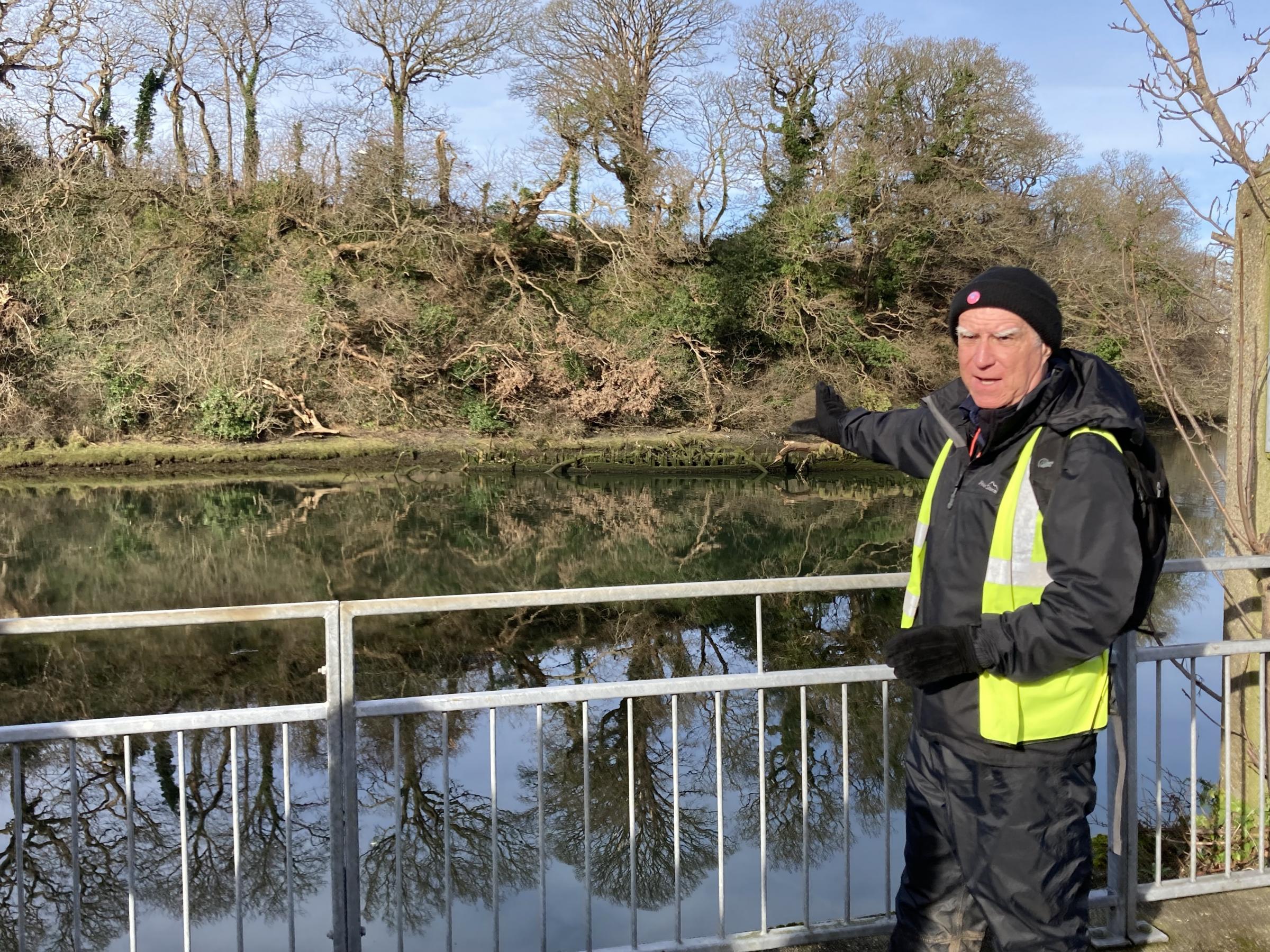 Rhys Mwyn points out the site of a shipwreck at Caernarfon (Image Dale Spridgeon)