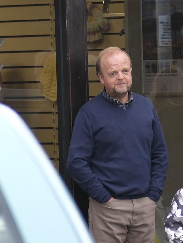 DJ Peaks photography snapped this photo of Toby Jones outside the recreated Post Office [St Davids Hospice charity outlet has been transformed into the Post Office]. (Image: David Peacock of DJ Peaks photography.)